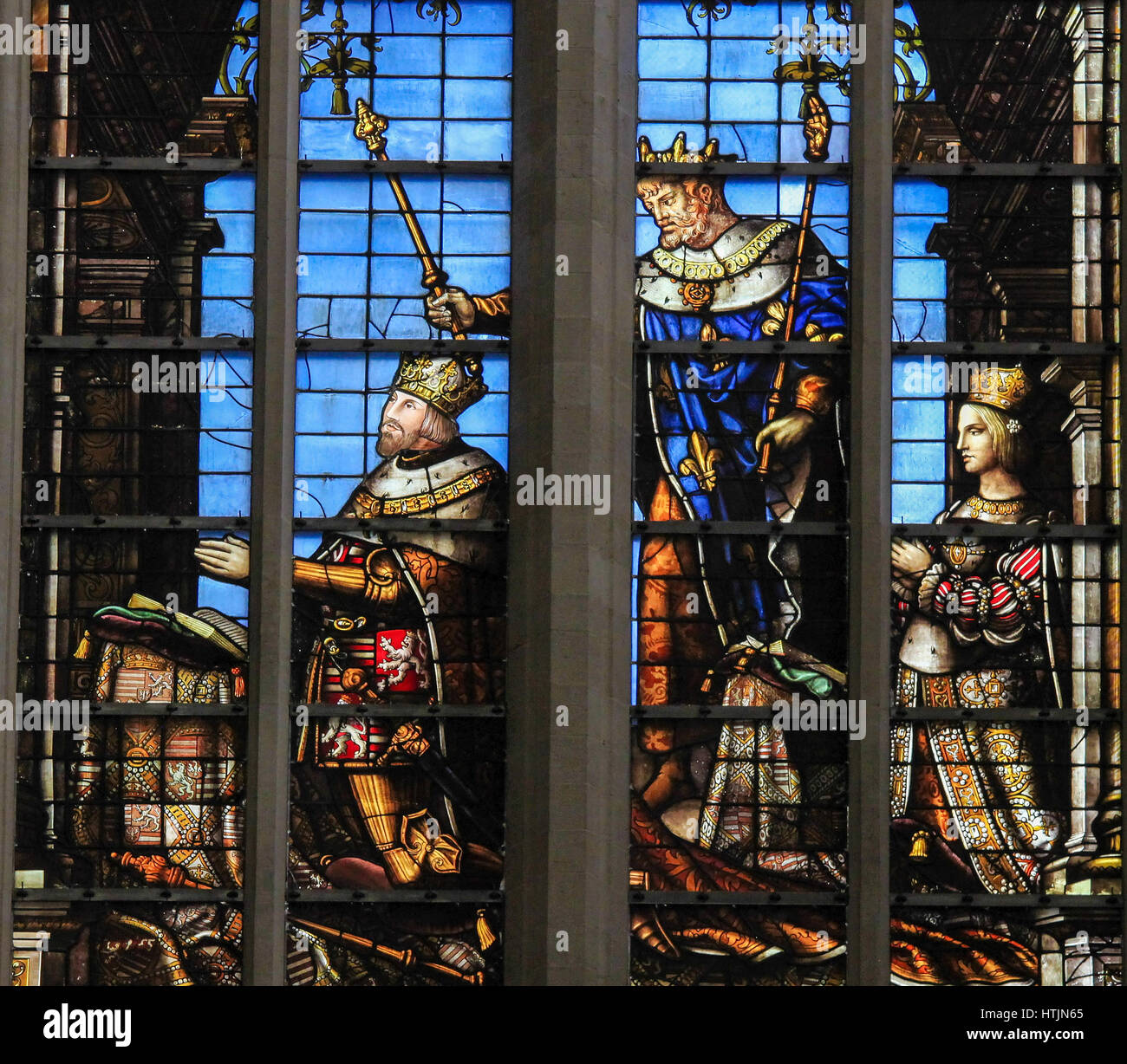 Stained glass depicting Louis II of Hungary, his patron St Louis and his wife Marie (sister of Charles V), in the Cathedral of Brussels, Belgium. Stock Photo