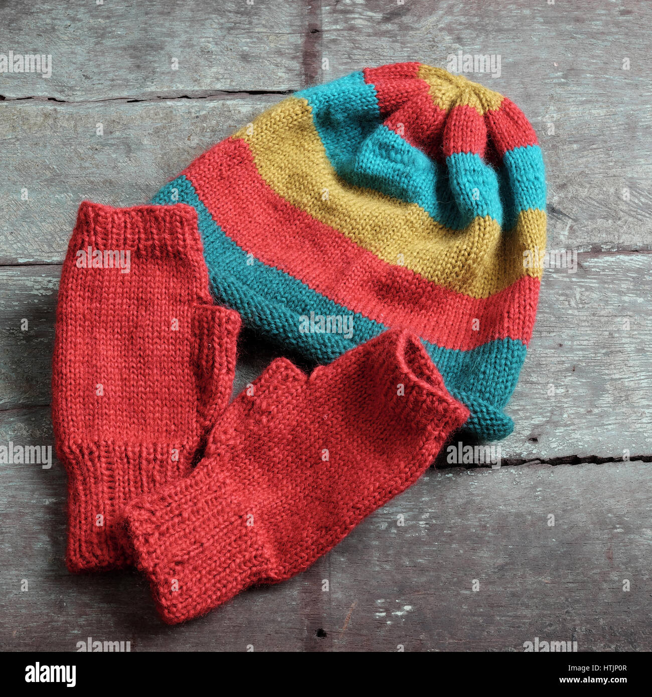 Handmade gift for winter, knitted gloves and knit hat for cold day, group of colorful yarn make warm, knit accessories is hobby activity of woman Stock Photo