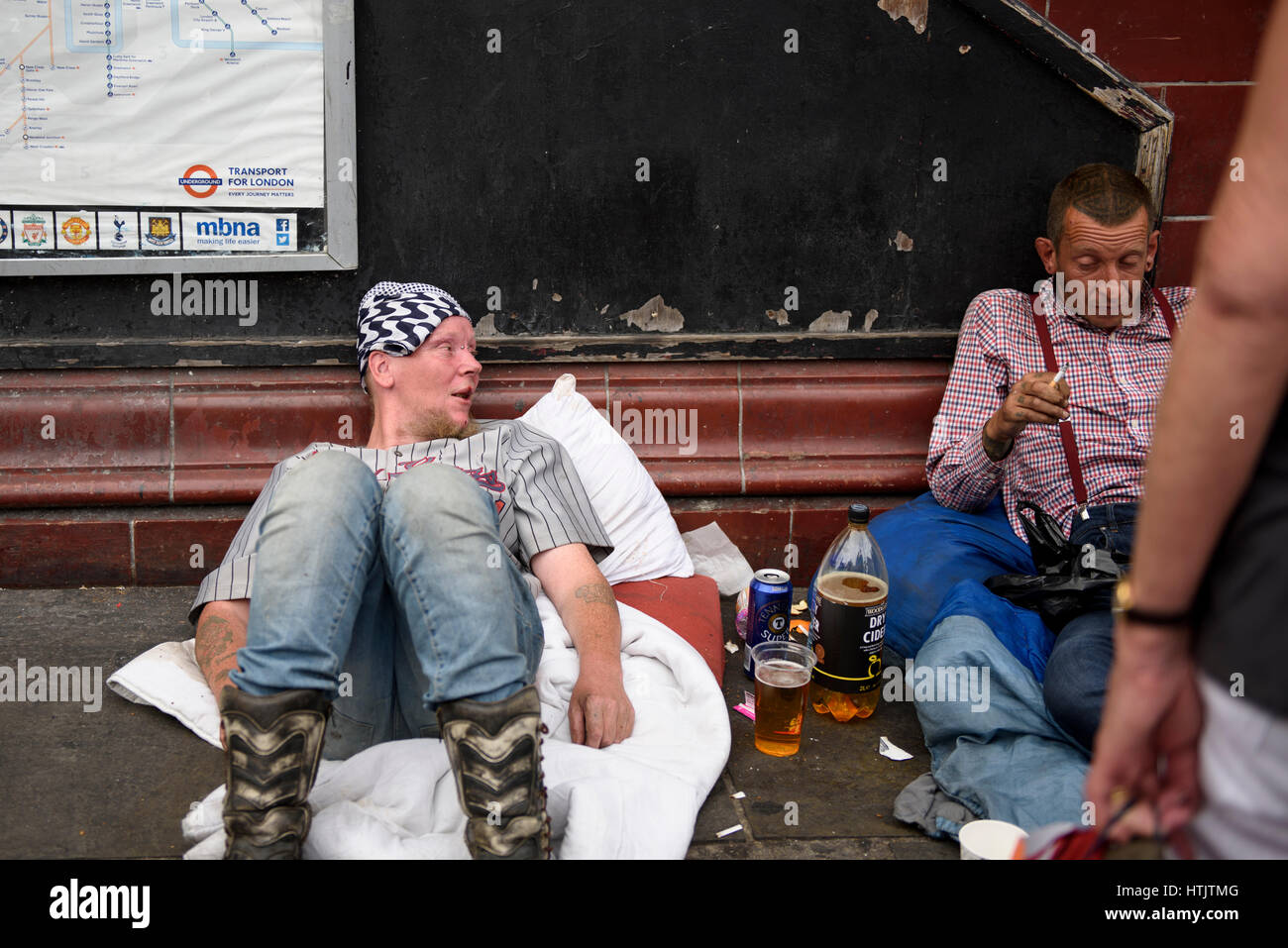 Men laying on the ground outside the Camden Town station Stock Photo ...