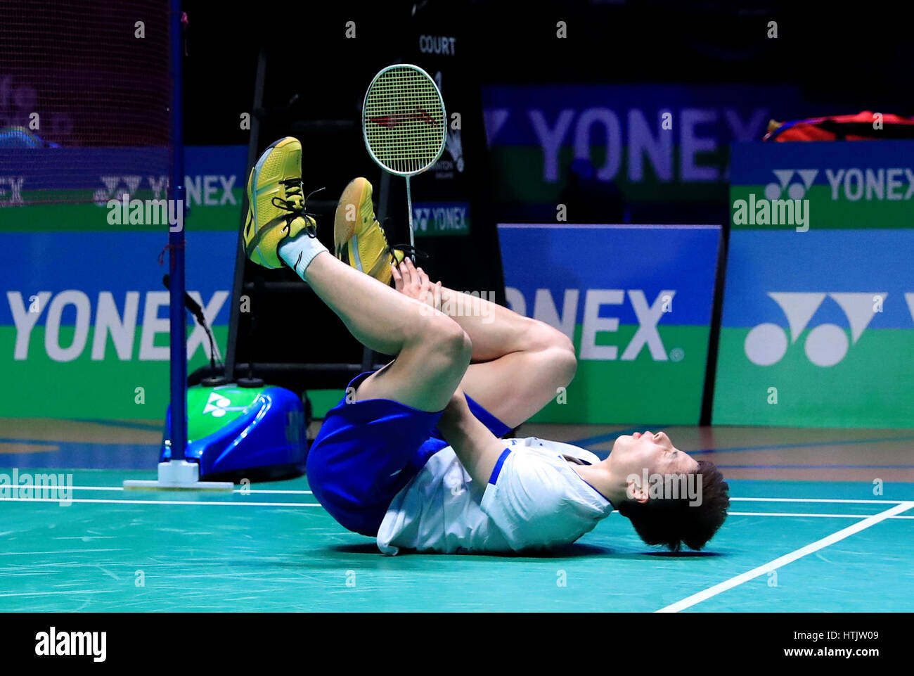 China's Yuqi Shi after receiving an injury against Malaysia's Chong Wei ...