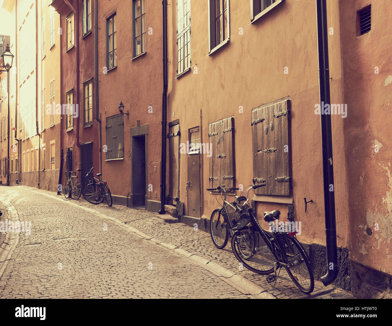 Bicycles outside houses in cobbled street of Gamla Stan, Stockholm's old town, Sweden, Scandinavia Stock Photo