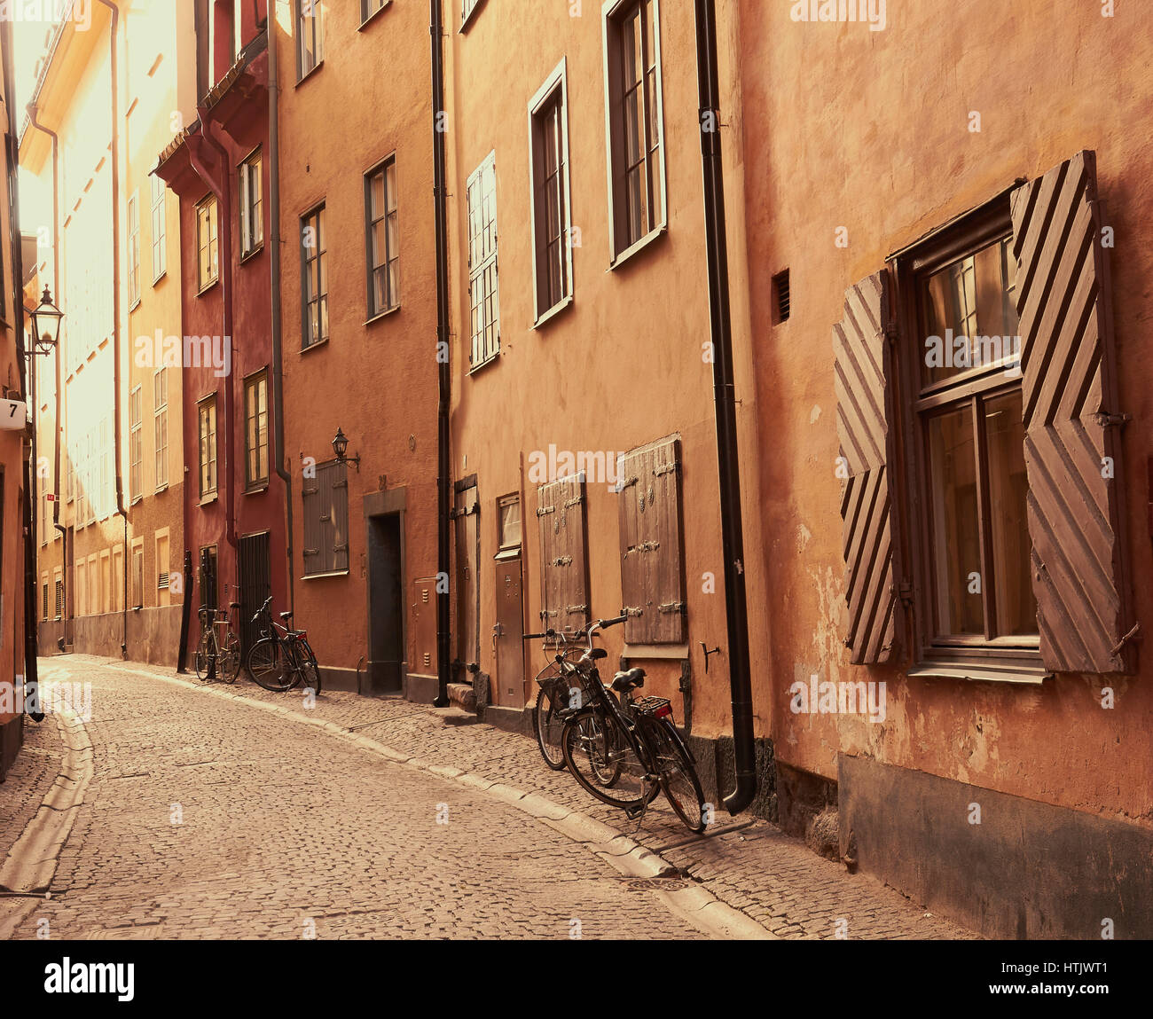 Bicycles outside houses in cobbled street of Gamla Stan, Stockholm's old town, Sweden, Scandinavia Stock Photo