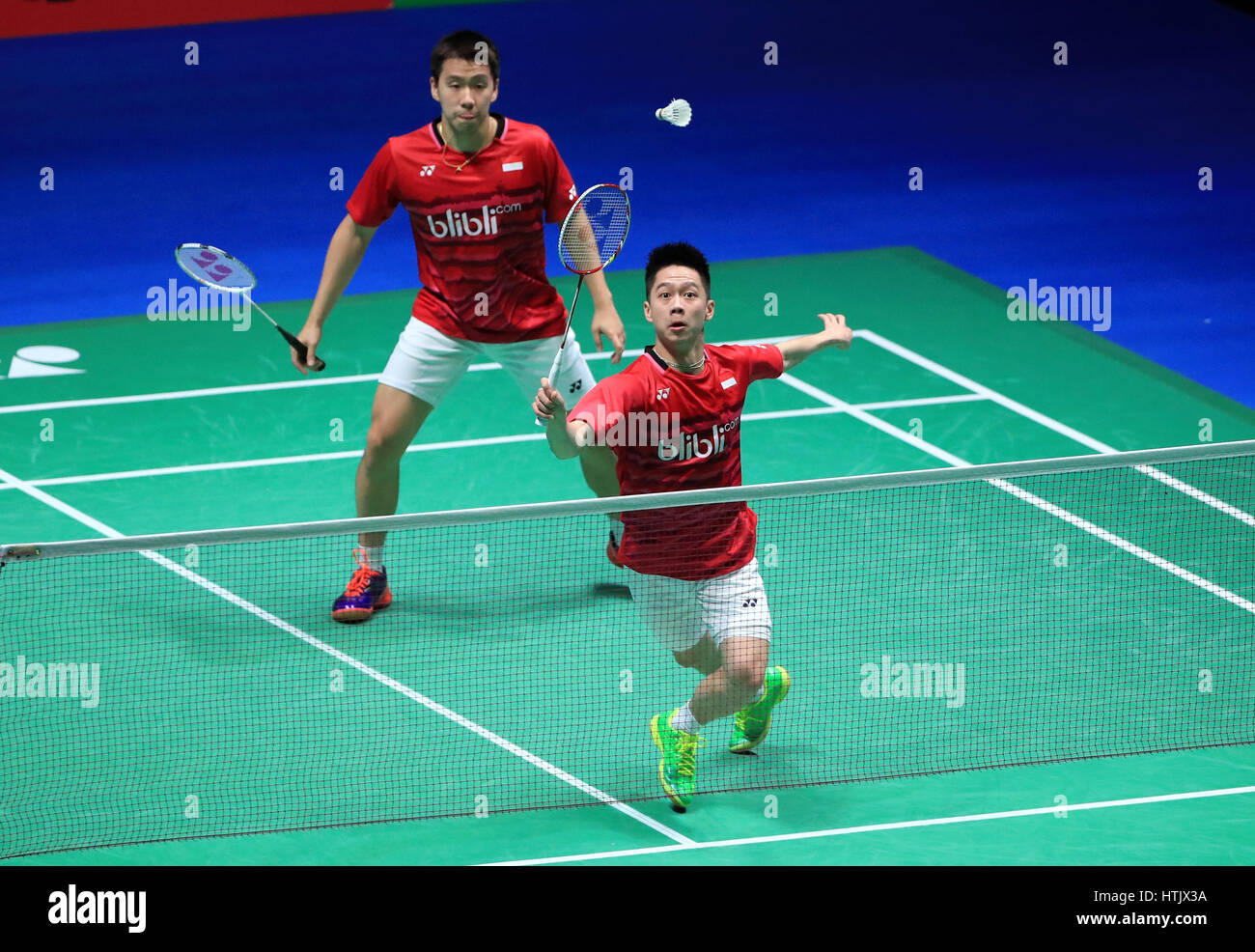 Indonesia's Marcus Fernaldi and Kevin Sanjaya against China's Li Junhui and Liu Yuchen in the Men's Doubles Final during day six of the YONEX All England Open Badminton Championships at the Barclaycard Arena, Birmingham. Stock Photo