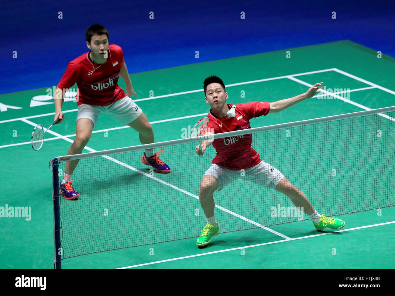 Indonesia's Marcus Fernaldi and Kevin Sanjaya against China's Li Junhui and Liu Yuchen in the Men's Doubles Final during day six of the YONEX All England Open Badminton Championships at the Barclaycard Arena, Birmingham. Stock Photo