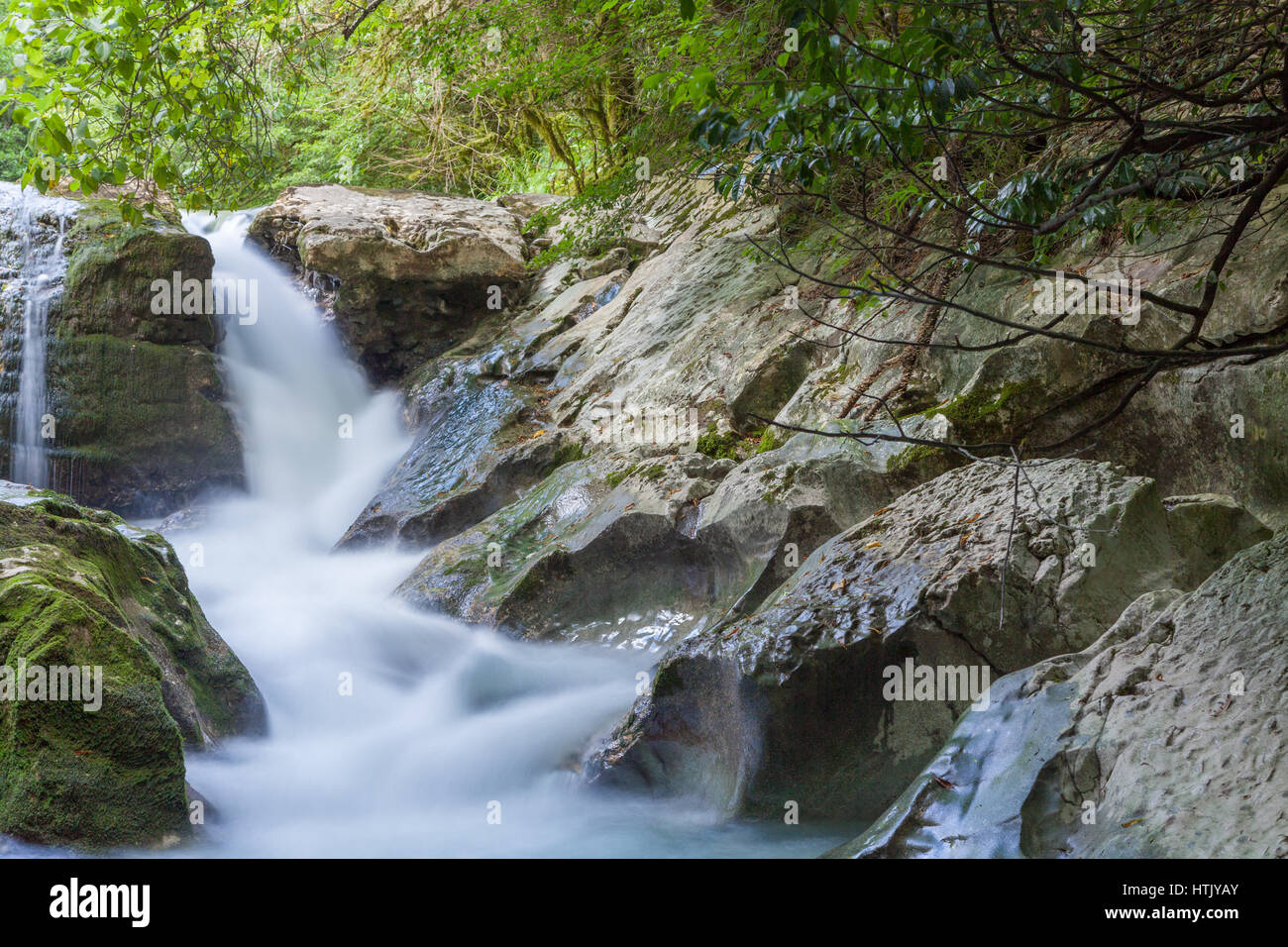 Waterfall on a mountain river in Caucasus Stock Photo