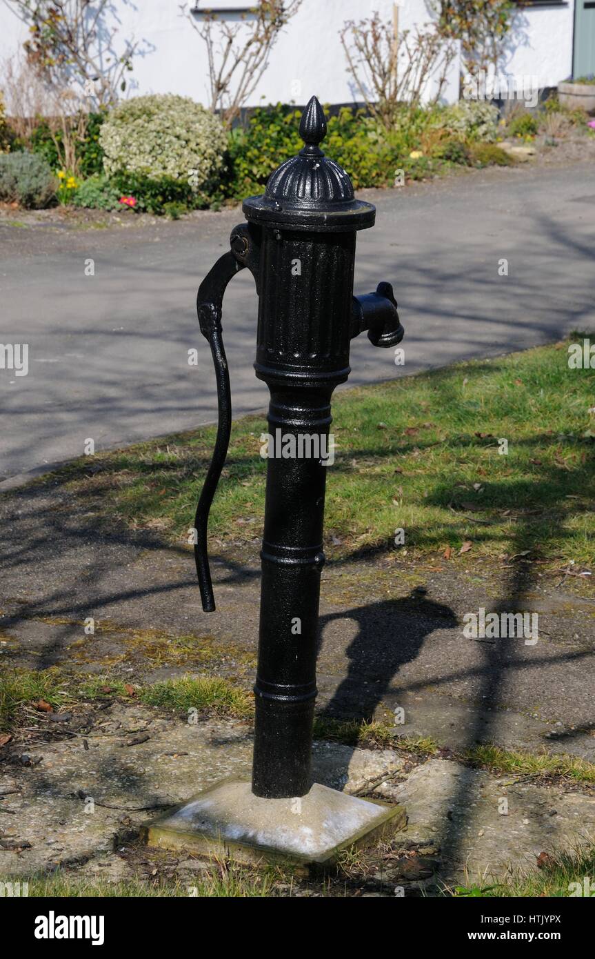 Pump, Foxton, Cambridgeshire, stands near the corner of Mortimers Lane. The pump is a cast iron stand pump dating to 1873 made by Henry Bamford & sons Stock Photo