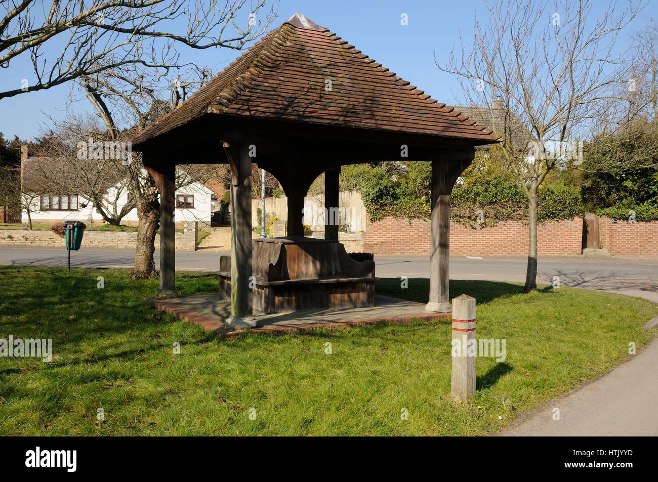 Shelter, The Green Foxton, Cambridgeshire. The shelter has two beams carved with the inscription “IN THE NAME of THE LORD JESUS and in GRATEFUL and LO Stock Photo