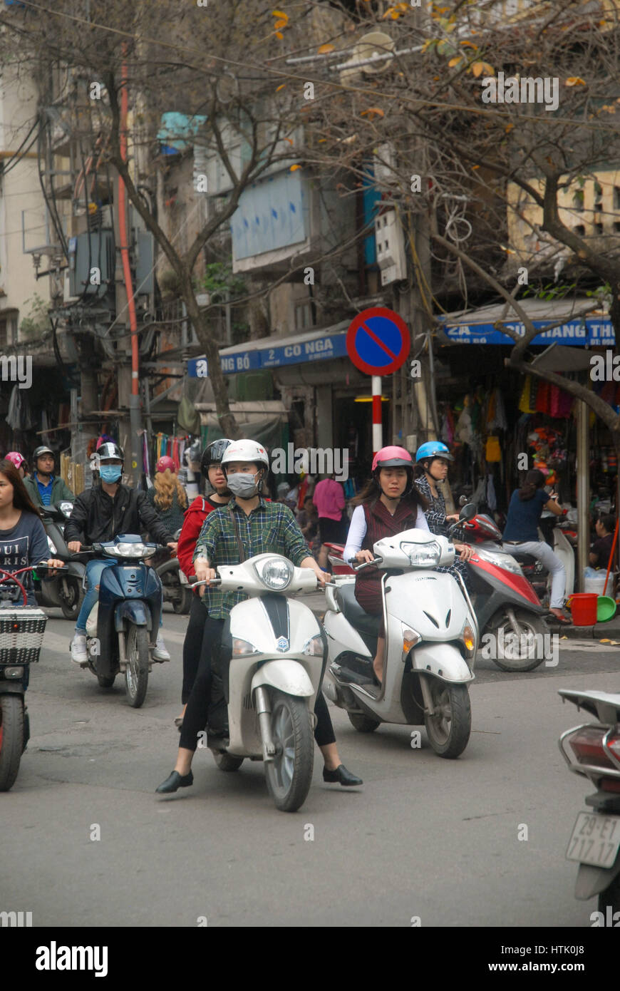 People in the street on their motorbikes, Hanoi, Vietnam. Stock Photo