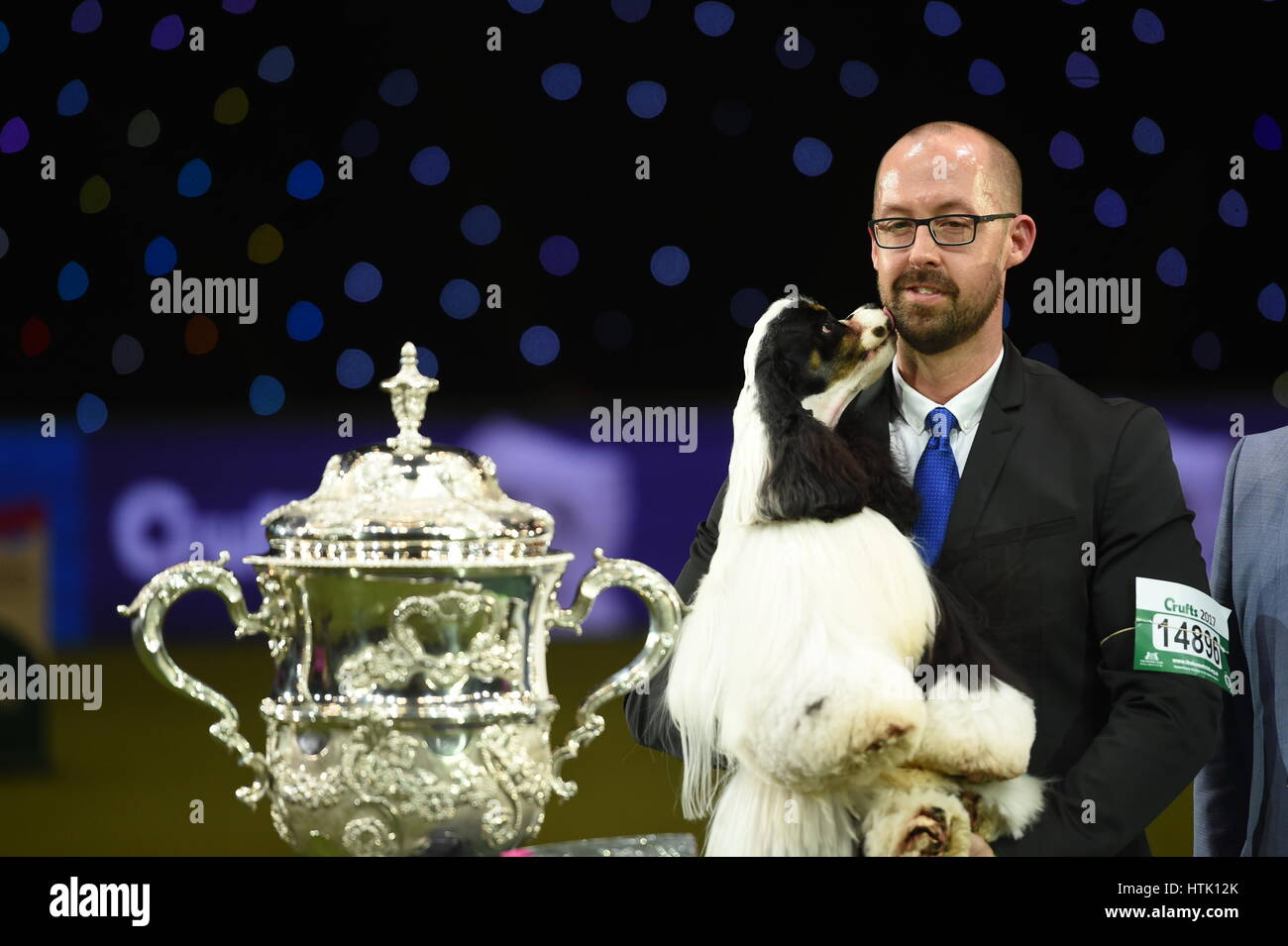Owner Jason Lynn with Afterglow Miami Ink the American Cocker Spaniel, who has been crowned Best In Show during day four of Crufts 2017 at the NEC in Birmingham. Stock Photo