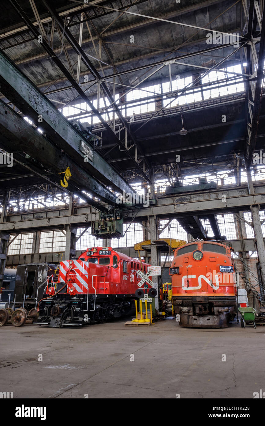 CN diesel locomotive engines inside the Michigan Central Railroad Locomotive Shops / hangar in the Elgin County Railway Museum, St Thomas, Ontario. Stock Photo