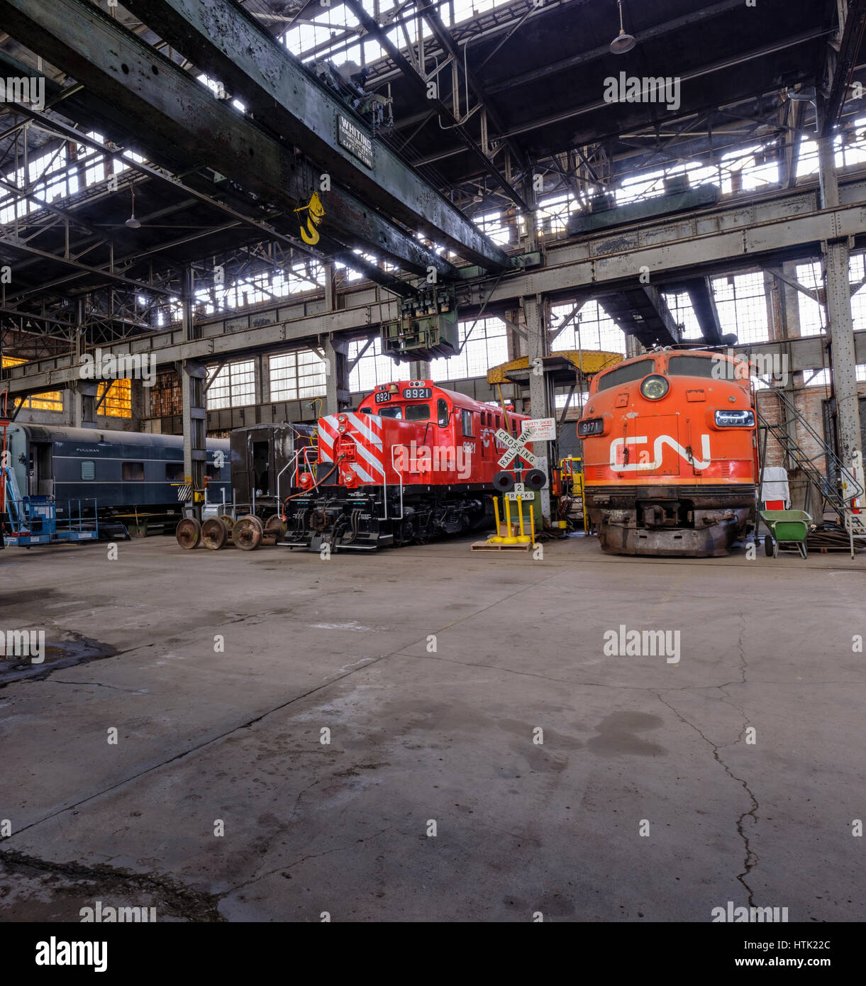 CN diesel locomotive engines inside the Michigan Central Railroad Locomotive Shops / hangar in the Elgin County Railway Museum, St Thomas, Ontario. Stock Photo