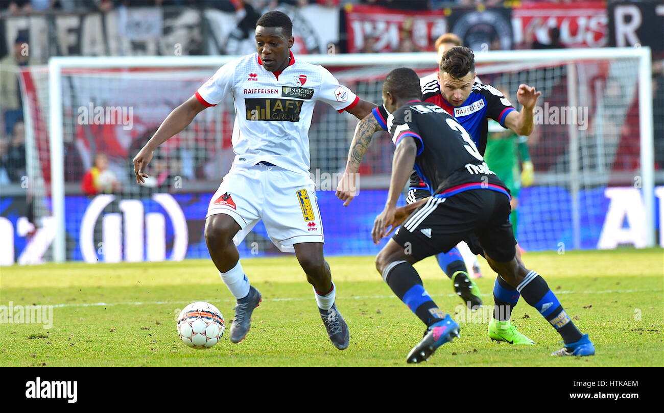 Sion, 12.03.2017, Football Raiffeisen Super League, FC Sion - FC B‰le, Geoffrey Bia (FC Sion 63) the duel with Renato Steffen (FCB 11) and Adama Traore (FCB 3) Photo: Cronos/Frederic Dubuis Stock Photo