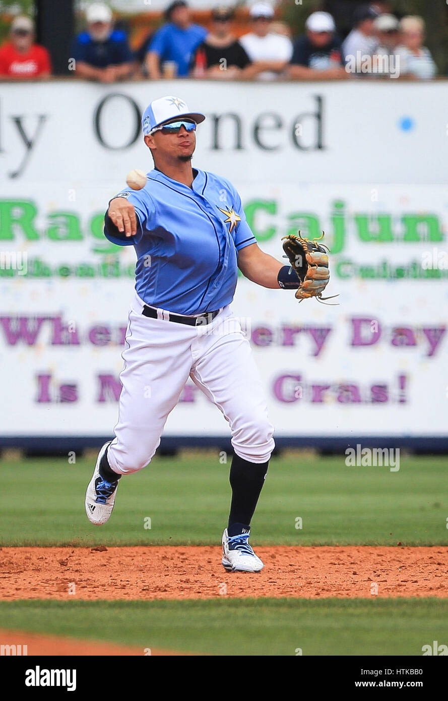 Port Charlotte, Florida, USA. 12th Mar, 2017. WILL VRAGOVIC | Times.Tampa Bay Rays shortstop Willy Adames (27) fields the grounder by Toronto Blue Jays second baseman Jake Elmore (21) in the sixth inning of the game between the Toronto Blue Jays and the Tampa Bay Rays at Charlotte Sports Park in Port Charlotte, Fla. on Sunday, March 12, 2017. The Tampa Bay Rays beat the Toronto Blue Jays 8-2. Credit: Will Vragovic/Tampa Bay Times/ZUMA Wire/Alamy Live News Stock Photo