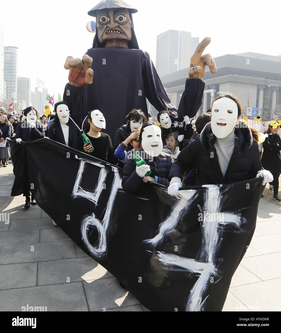 The sixth anniversary of the 2011 Fukushima nuclear disaster, Mar 11, 2017 : People attend a memorial rally marking the sixth anniversary of the 2011 Fukushima nuclear disaster in Seoul, South Korea. The March 11, 2011 earthquake and tsunami killed more than 18,000 people in Japan. Participants demanded the government to stop nuclear project and establish more solar energy generation during a rally which was held also as a part of mass rally held to celebrate after the Constitutional Court on Friday upheld the impeachment of President Park Geun-hye. Korean characters on the placard read,'Obliv Stock Photo
