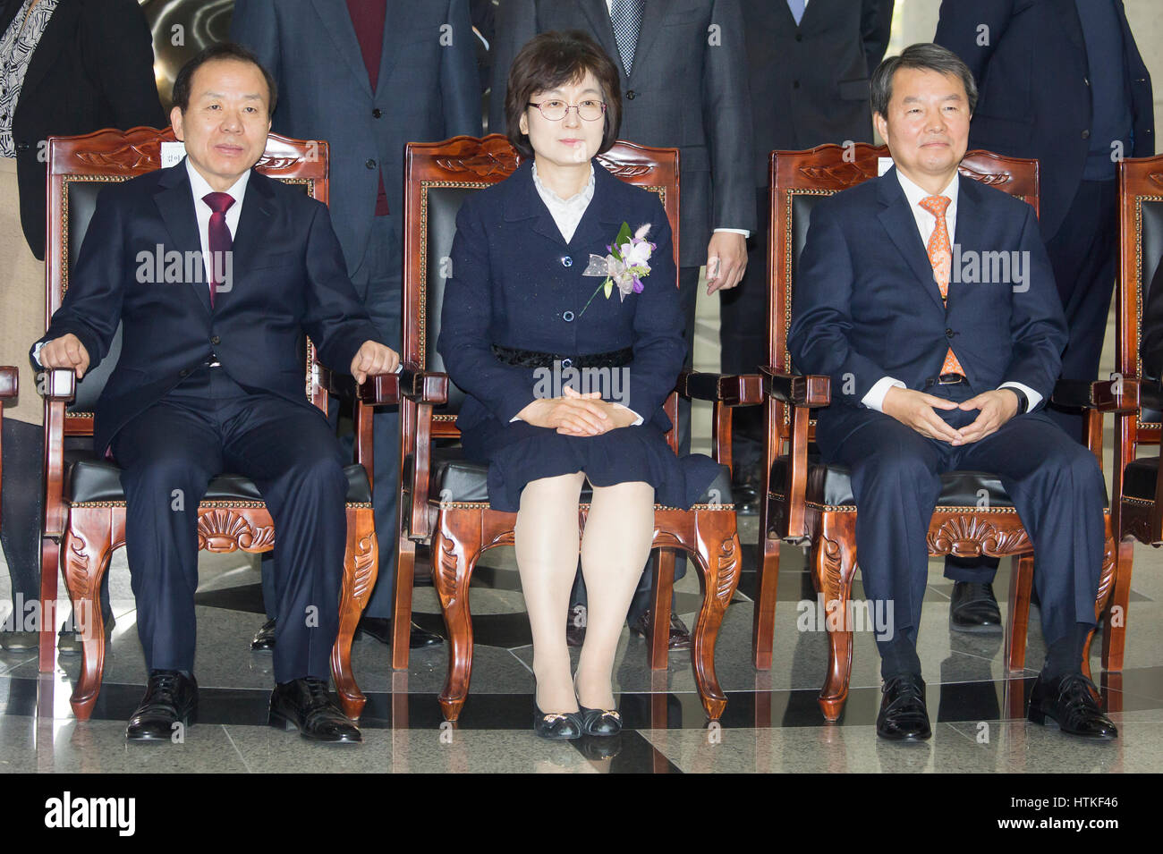 Seoul, South Korea. 13th March 2017. Kim Yi-Su, Lee Jung-Mi and Lee Jin-sung,  Acting chief of the Constitutional Court of South Korea Lee Jung-Mi (C) attends her retirement ceremony as judges Kim Yi-su (L) and Lee Jin-sung look on at the court in Seoul, South Korea. Lee completed six-year term on Monday, three days after the court's deliberations on dismissing ex-South Korean President Park Geun-Hye. Credit: Lee Jae-Won/AFLO/Alamy Live News Stock Photo