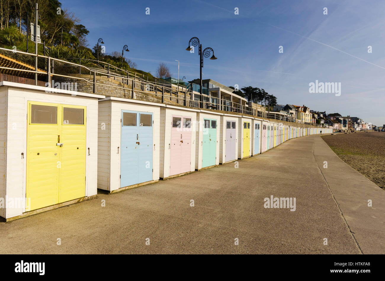 Lyme Regis, Dorset, UK.  13th March 2017.  UK Weather. Beautiful warm spring sunshine and blues skies during the morning at the seaside resort of Lyme Regis on the Dorset Jurassic Coast.  The view is of the seafront beach huts on Marine Parade.  Photo by Graham Hunt/Alamy Live News Stock Photo