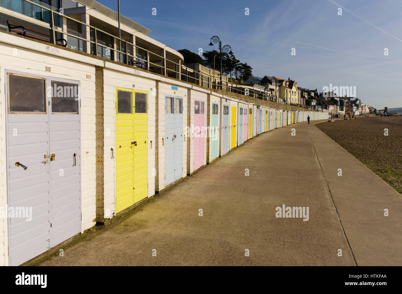 Lyme Regis, Dorset, UK.  13th March 2017.  UK Weather. Beautiful warm spring sunshine and blues skies during the morning at the seaside resort of Lyme Regis on the Dorset Jurassic Coast.  The view is of the seafront beach huts on Marine Parade.  Photo by Graham Hunt/Alamy Live News Stock Photo