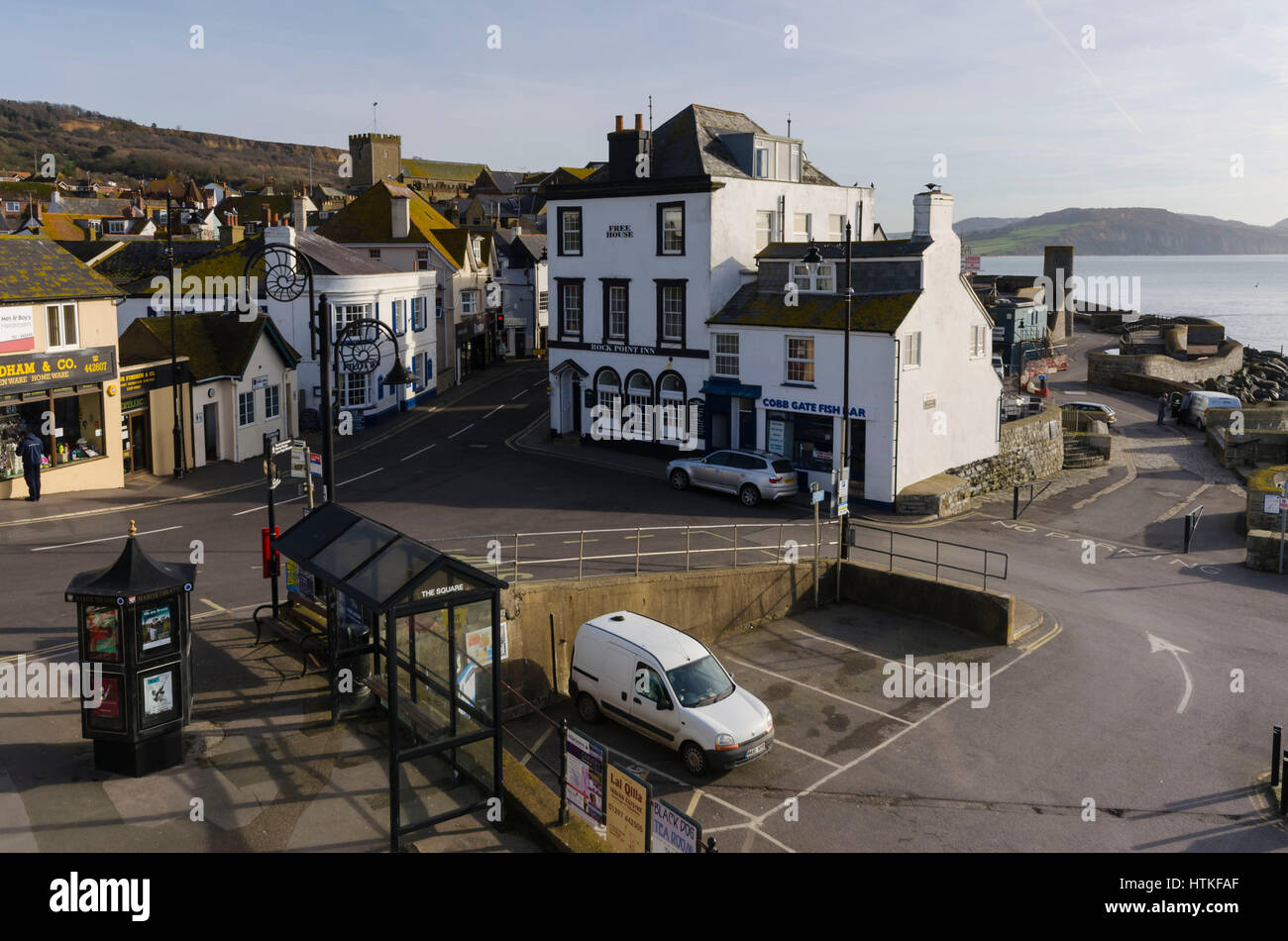 Lyme Regis, Dorset, UK.  13th March 2017.  UK Weather. Beautiful warm spring sunshine and blues skies during the morning at the seaside resort of Lyme Regis on the Dorset Jurassic Coast.  The view is of Cobb Gate at the bottom of Broad Street.  Photo by Graham Hunt/Alamy Live News Stock Photo