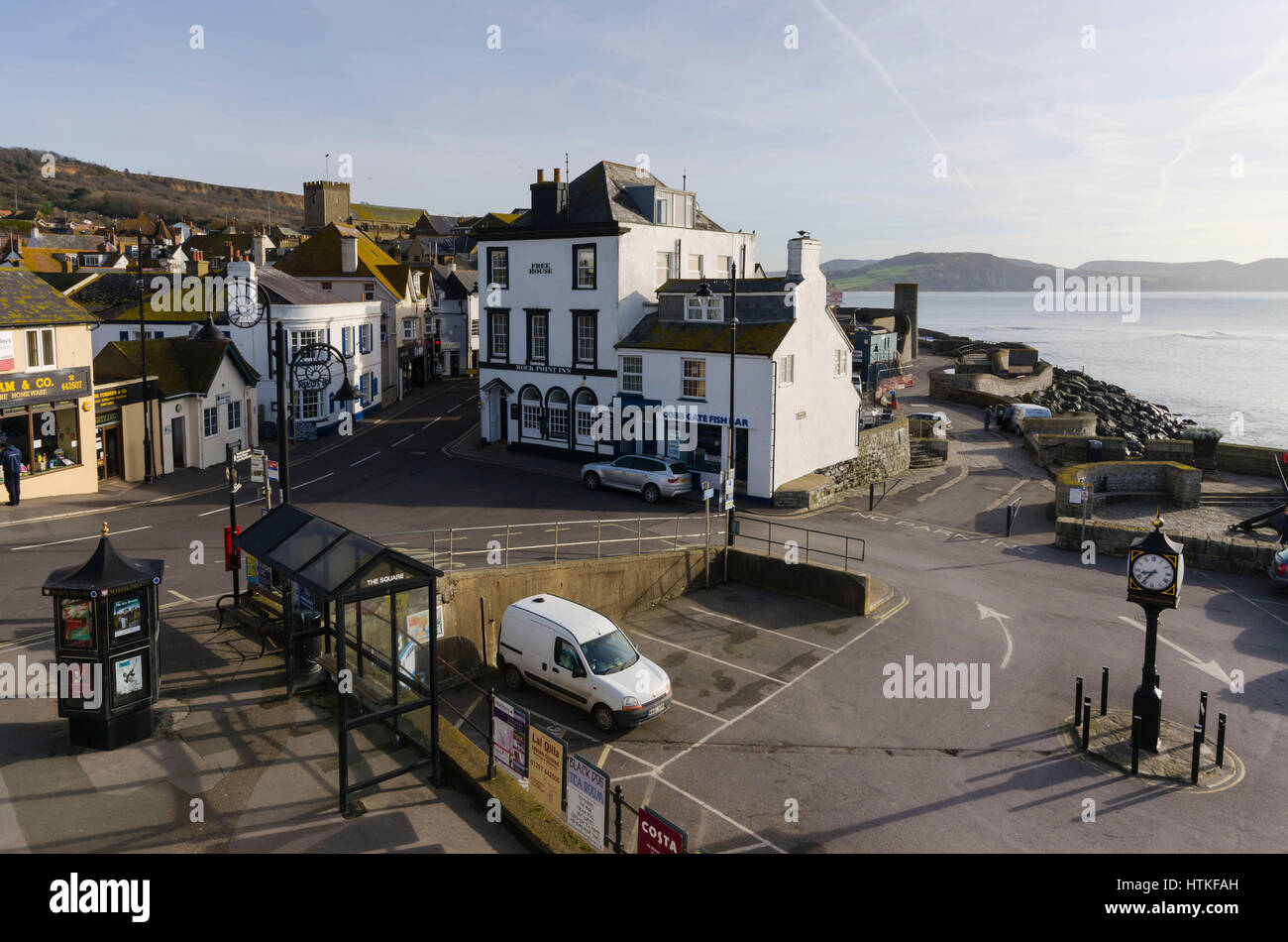 Lyme Regis, Dorset, UK.  13th March 2017.  UK Weather. Beautiful warm spring sunshine and blues skies during the morning at the seaside resort of Lyme Regis on the Dorset Jurassic Coast.  The view is of Cobb Gate at the bottom of Broad Street.  Photo by Graham Hunt/Alamy Live News Stock Photo