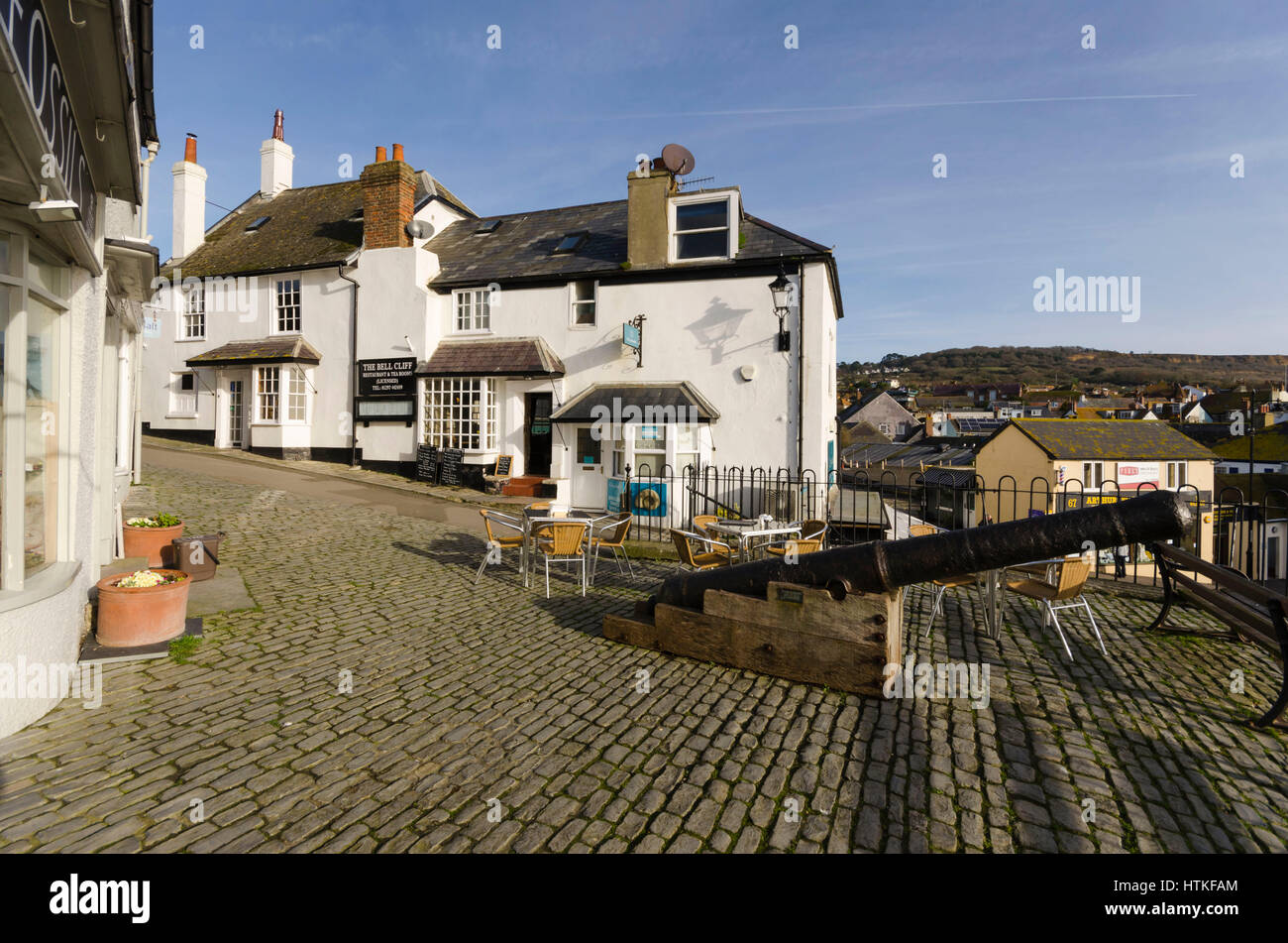Lyme Regis, Dorset, UK.  13th March 2017.  UK Weather. Beautiful warm spring sunshine and blues skies during the morning at the seaside resort of Lyme Regis on the Dorset Jurassic Coast.  The view is of Bell Cliff next to Broad Street.  Photo by Graham Hunt/Alamy Live News Stock Photo