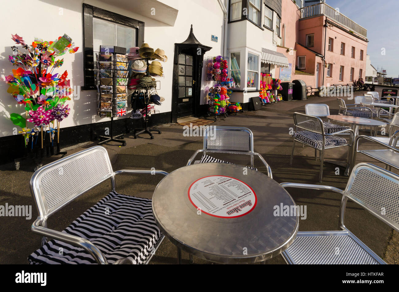 Lyme Regis, Dorset, UK.  13th March 2017.  UK Weather. Tables ready for customers. Beautiful warm spring sunshine and blues skies during the morning at the seaside resort of Lyme Regis on the Dorset Jurassic Coast.  Photo by Graham Hunt/Alamy Live News Stock Photo