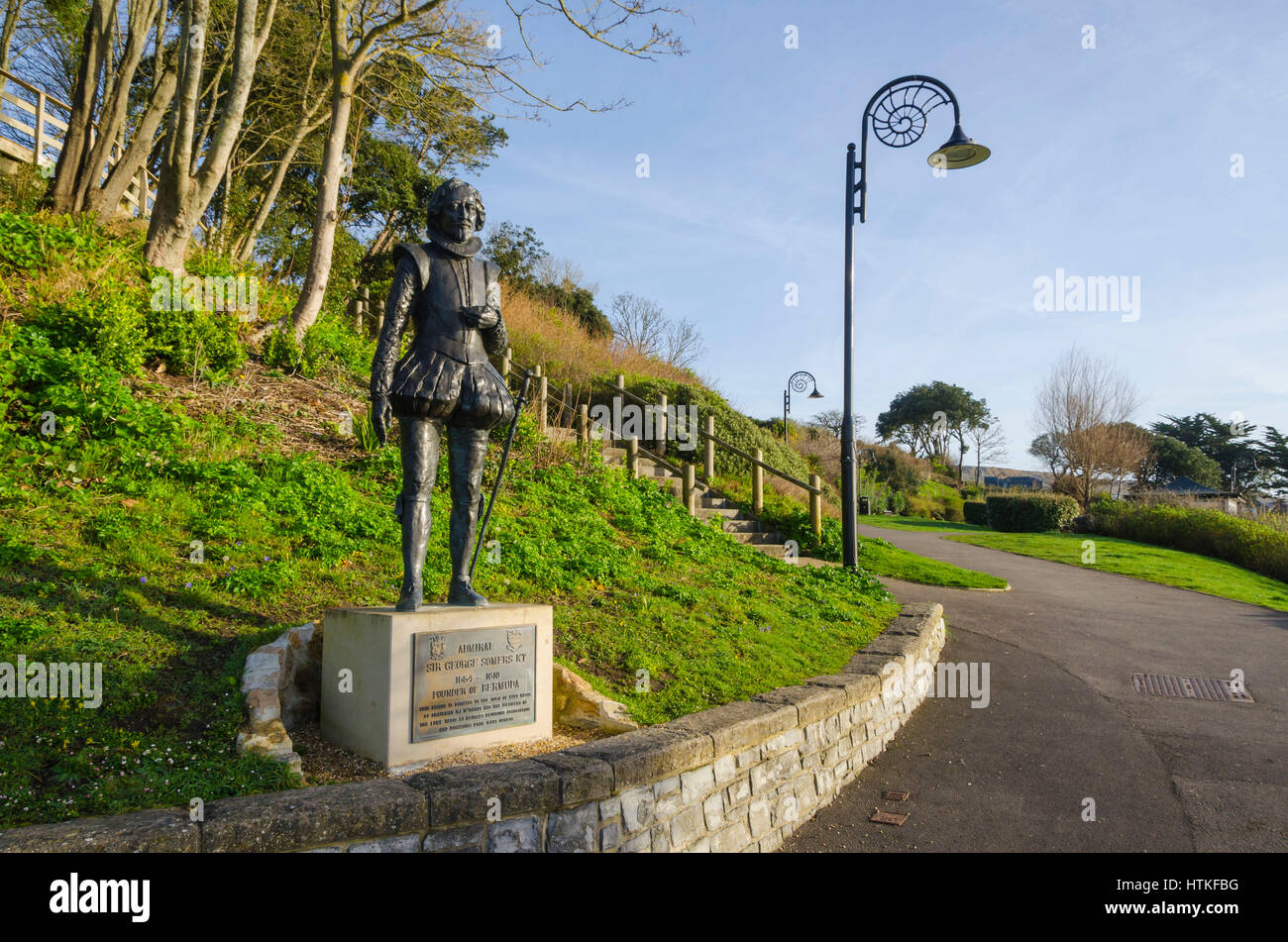 Lyme Regis, Dorset, UK.  13th March 2017.  UK Weather. Beautiful warm spring sunshine and blues skies during the morning at the seaside resort of Lyme Regis on the Dorset Jurassic Coast.  The view is of the statue of Admiral Sir George Sumers located in Langmoor Gardens.  Photo by Graham Hunt/Alamy Live News Stock Photo