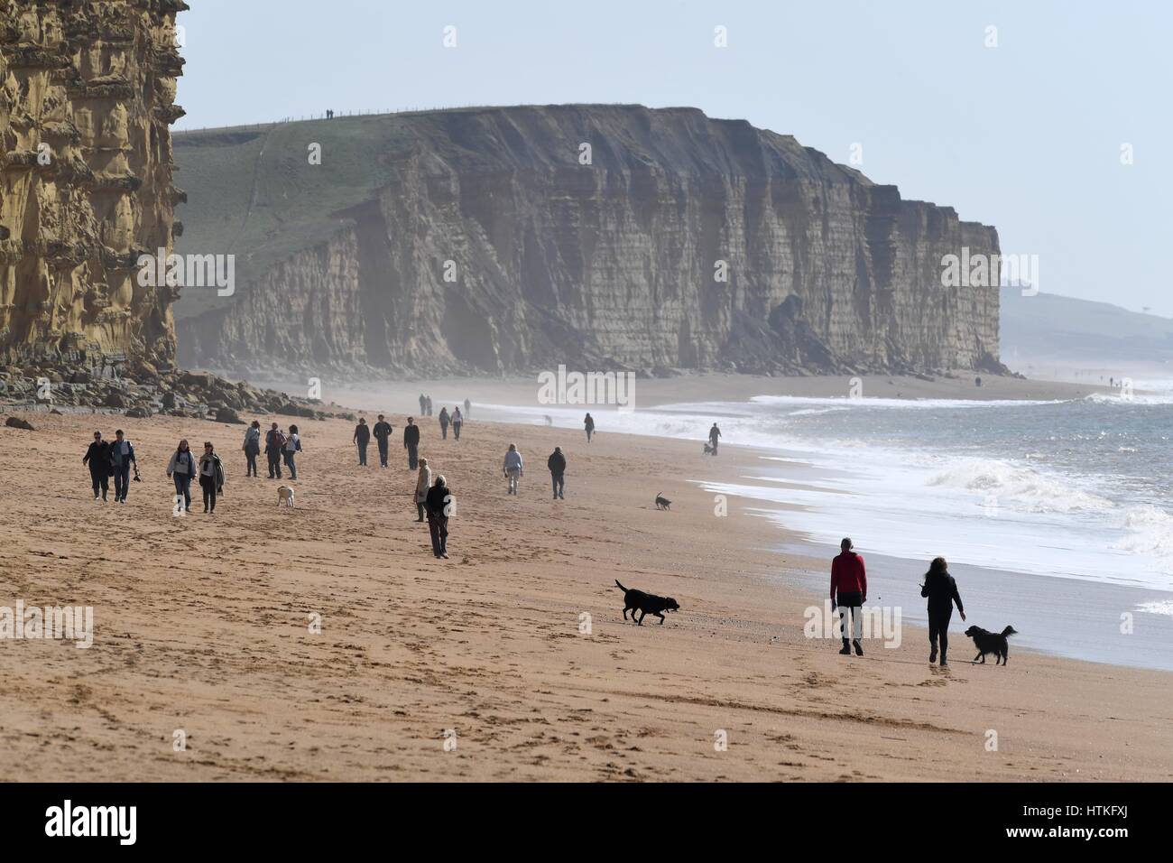 West Bay beach, Dorset, UK. 13th March 2017.UK Weather: Sunny and warm at West Bay, Dorset. Credit: Dorset Media Service/Alamy Live News Stock Photo