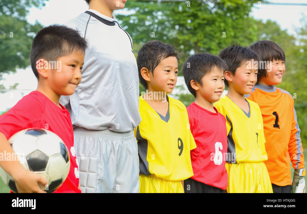 Japanese kids playing soccer Stock Photo Alamy
