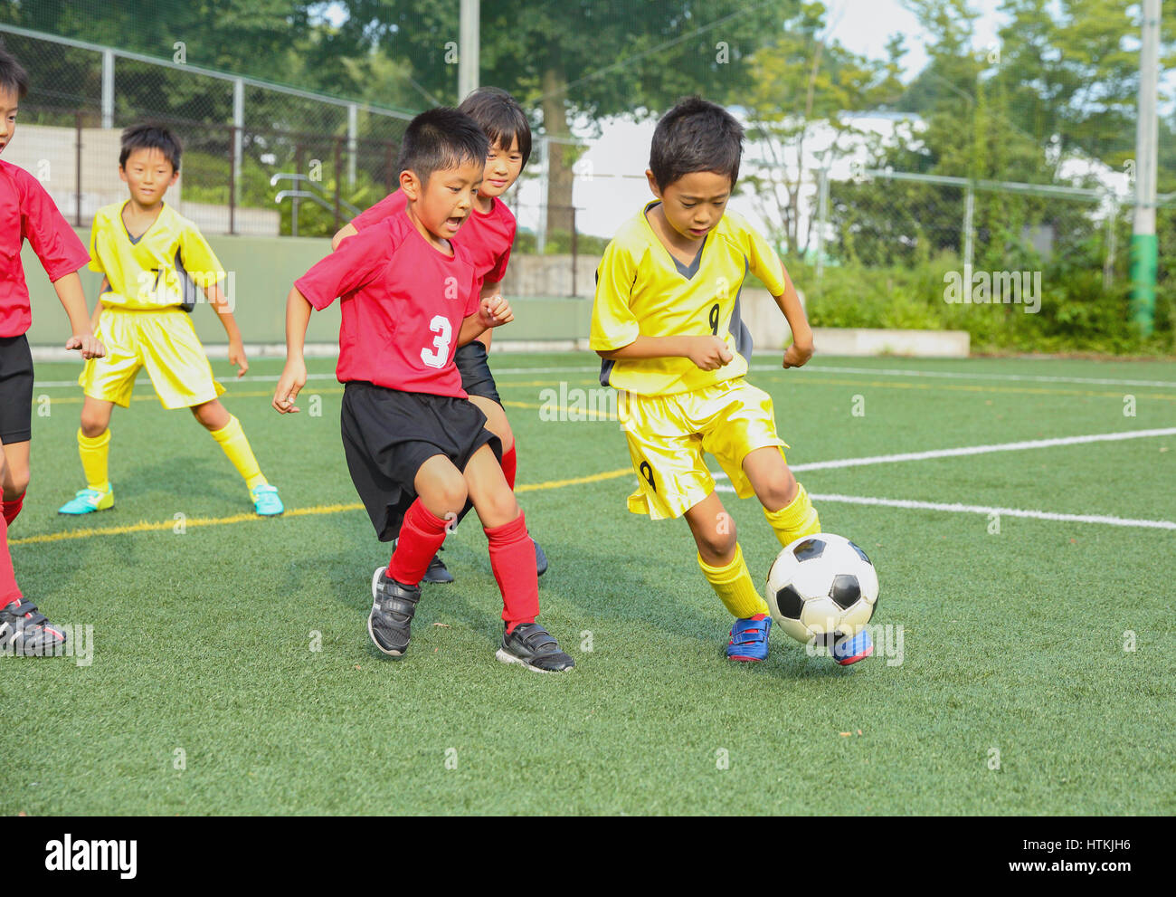 Japanese kids playing soccer Stock Photo Alamy