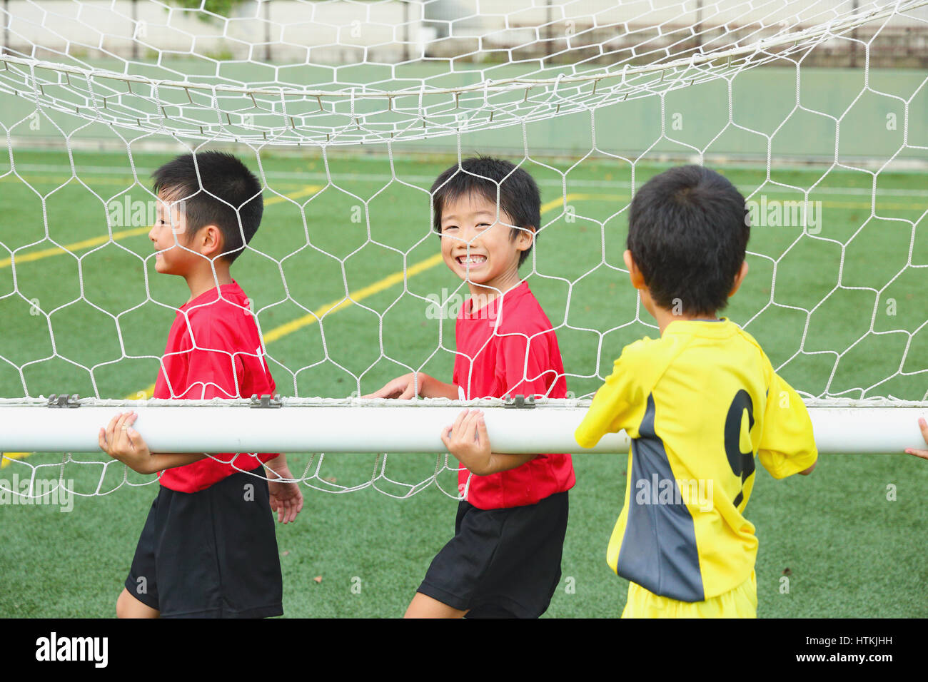 Japanese kids playing soccer Stock Photo Alamy