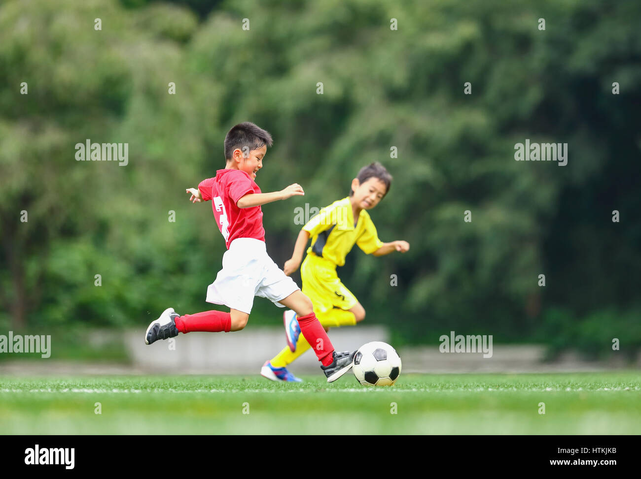 Japanese kids playing soccer Stock Photo Alamy