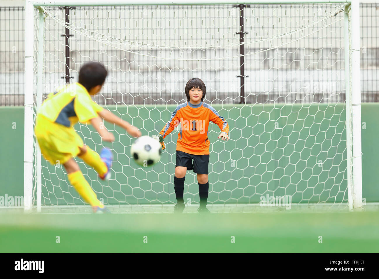 Japanese kids playing soccer Stock Photo Alamy