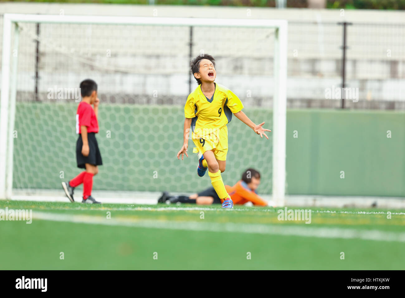 Japanese kids playing soccer Stock Photo Alamy
