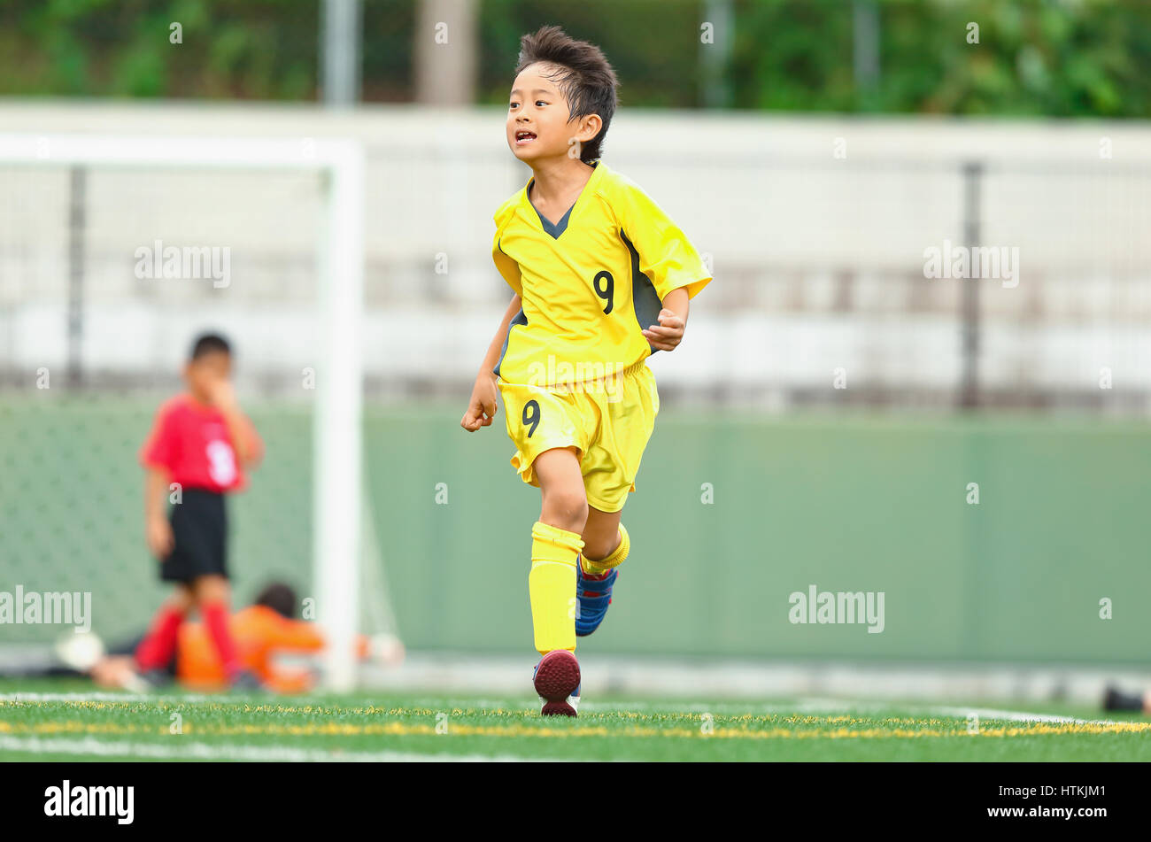 Japanese kids playing soccer Stock Photo Alamy