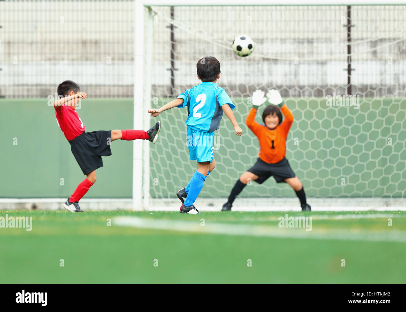 Japanese kids playing soccer Stock Photo Alamy