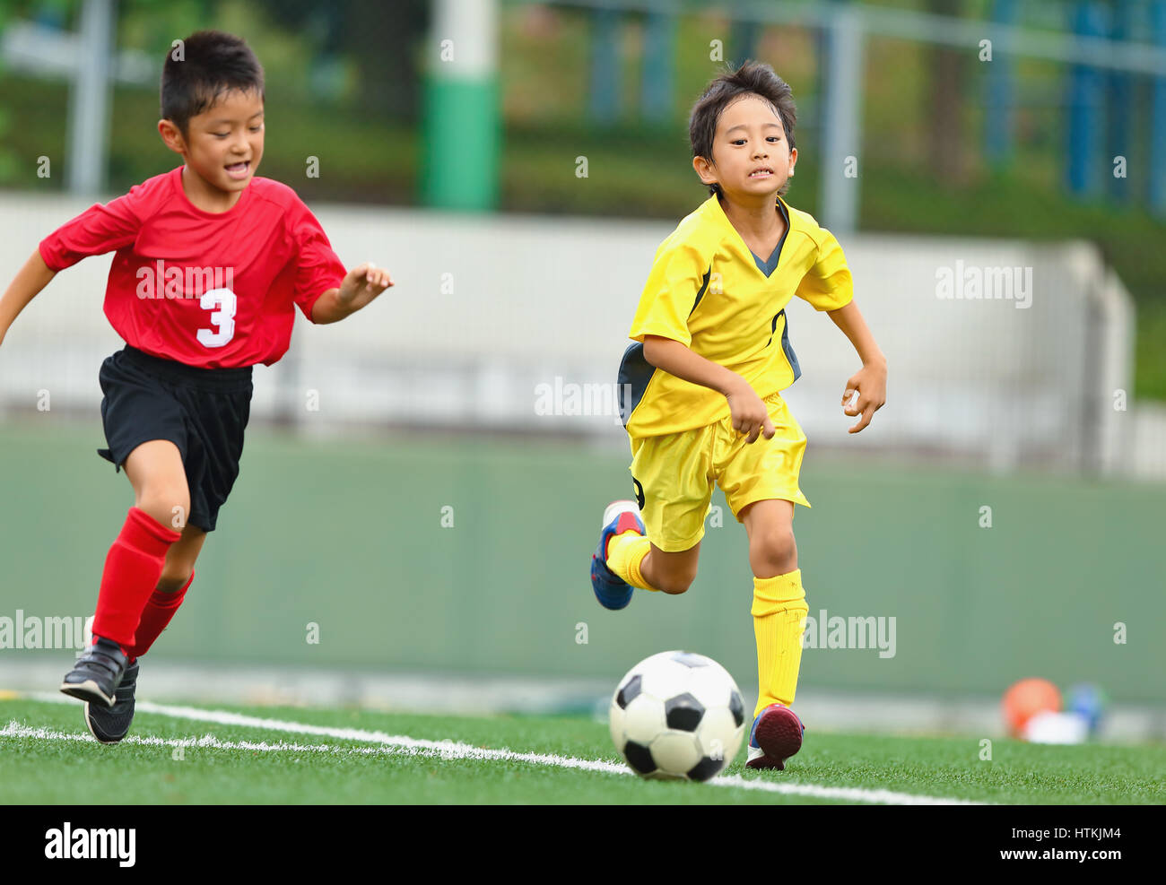 Japanese kids playing soccer Stock Photo Alamy