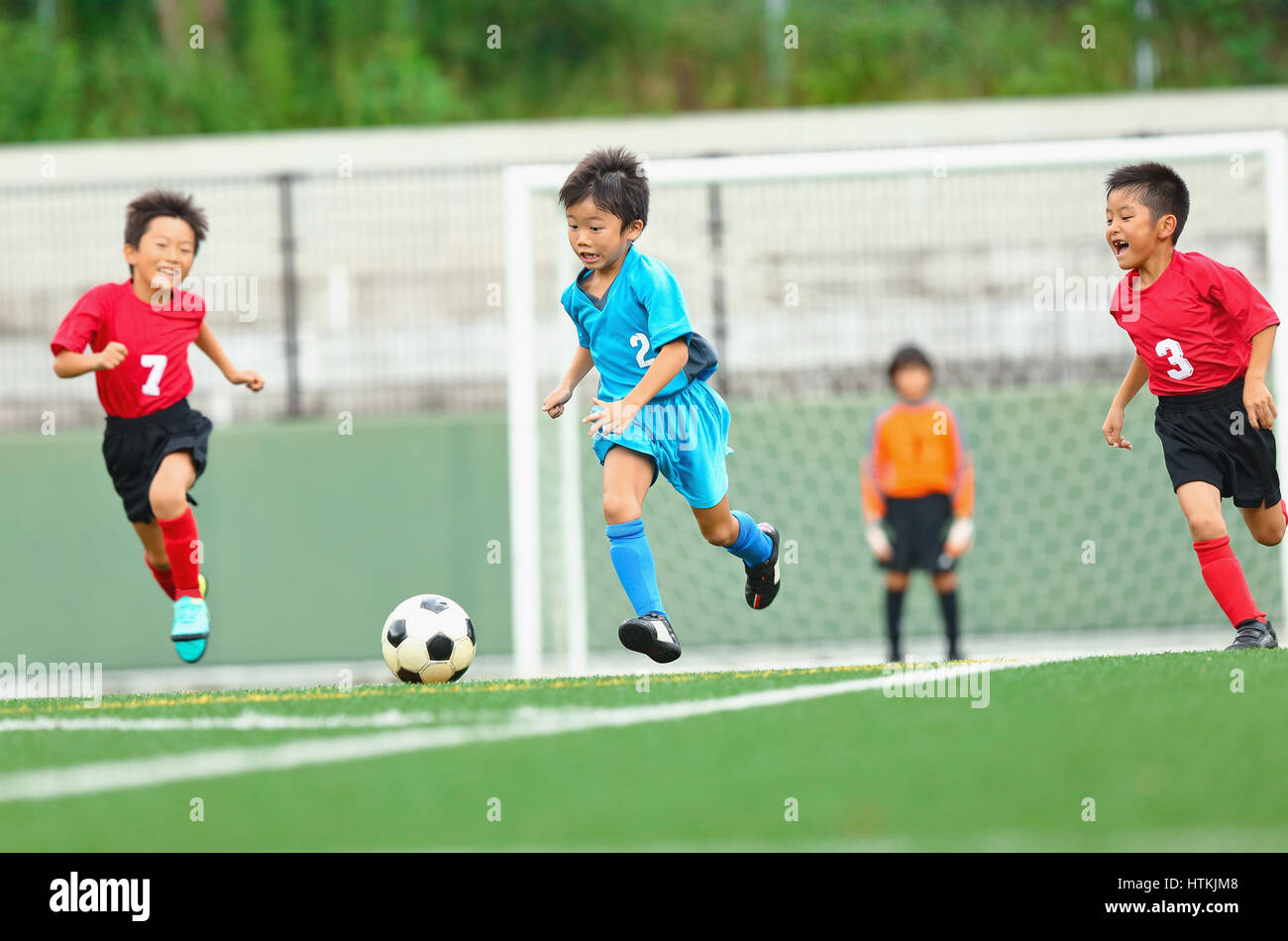 Japanese kids playing soccer Stock Photo Alamy