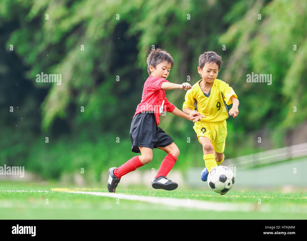 Japanese kids playing soccer Stock Photo Alamy