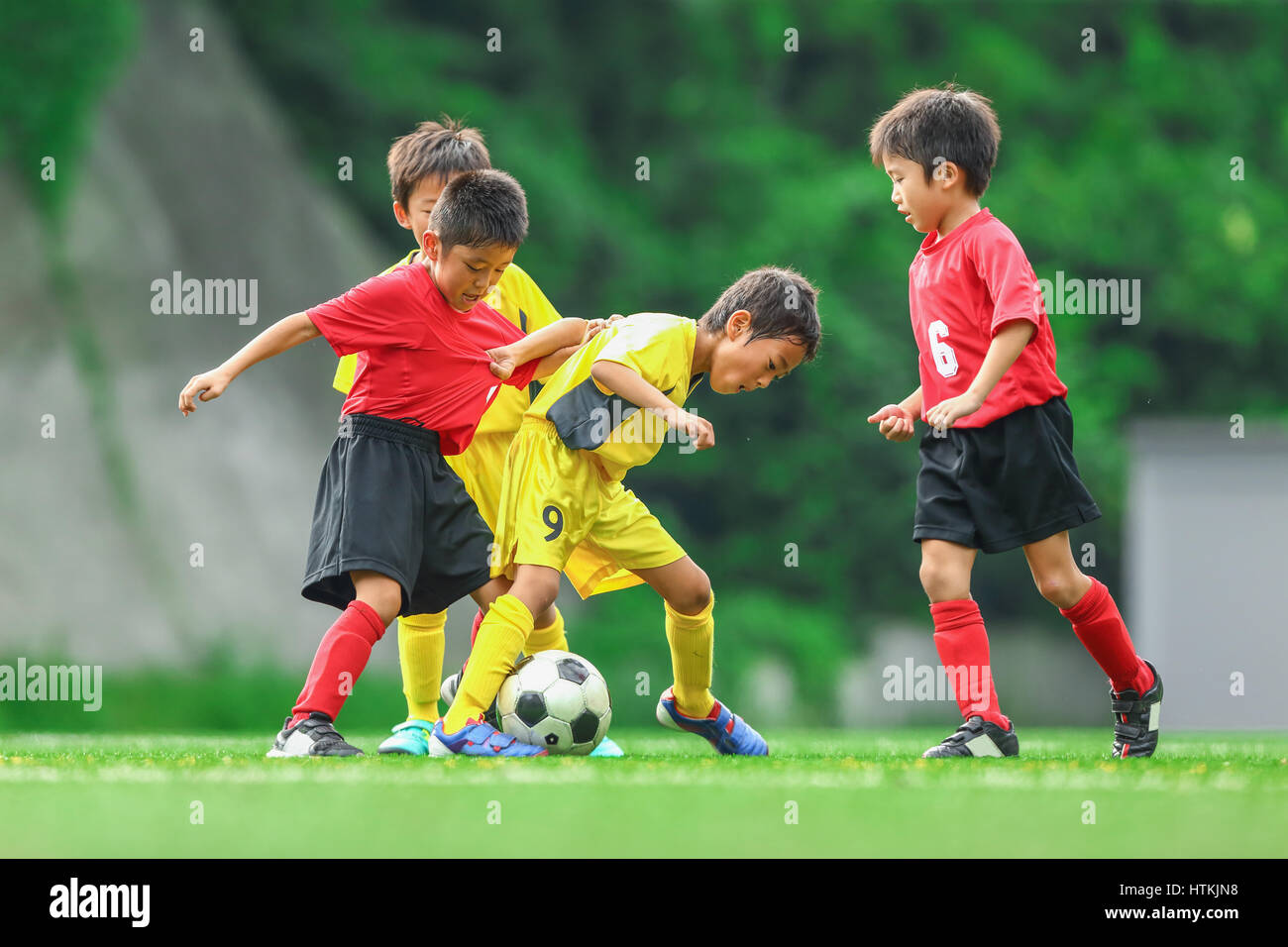 Japanese kids playing soccer Stock Photo Alamy
