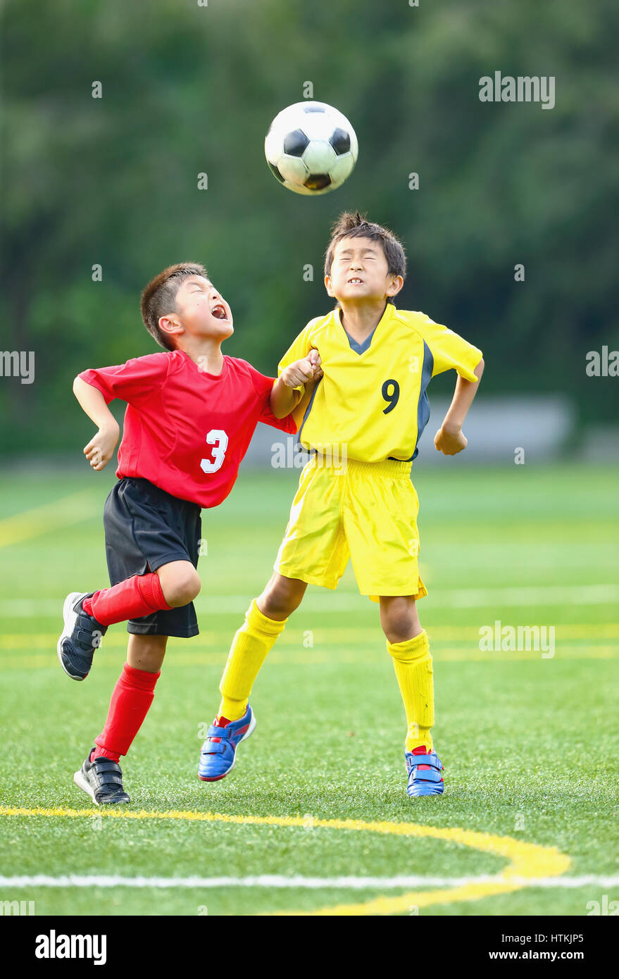 Japanese kids playing soccer Stock Photo Alamy