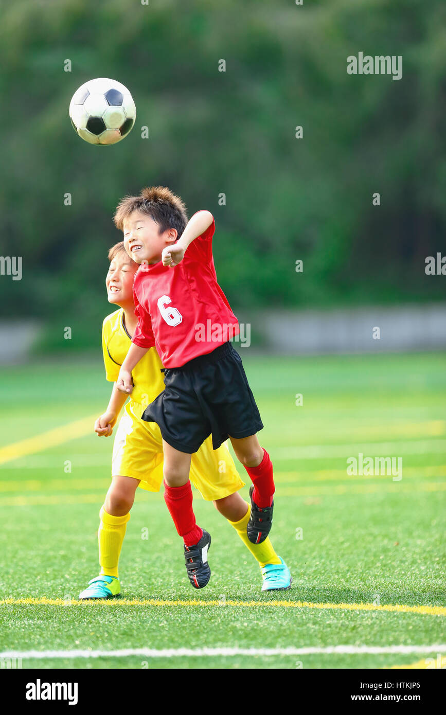 Japanese kids playing soccer Stock Photo Alamy