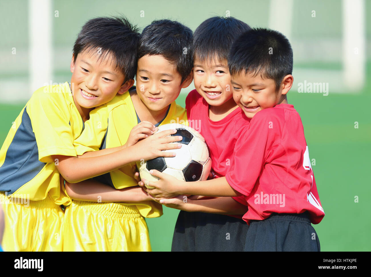 Japanese kids playing soccer Stock Photo Alamy
