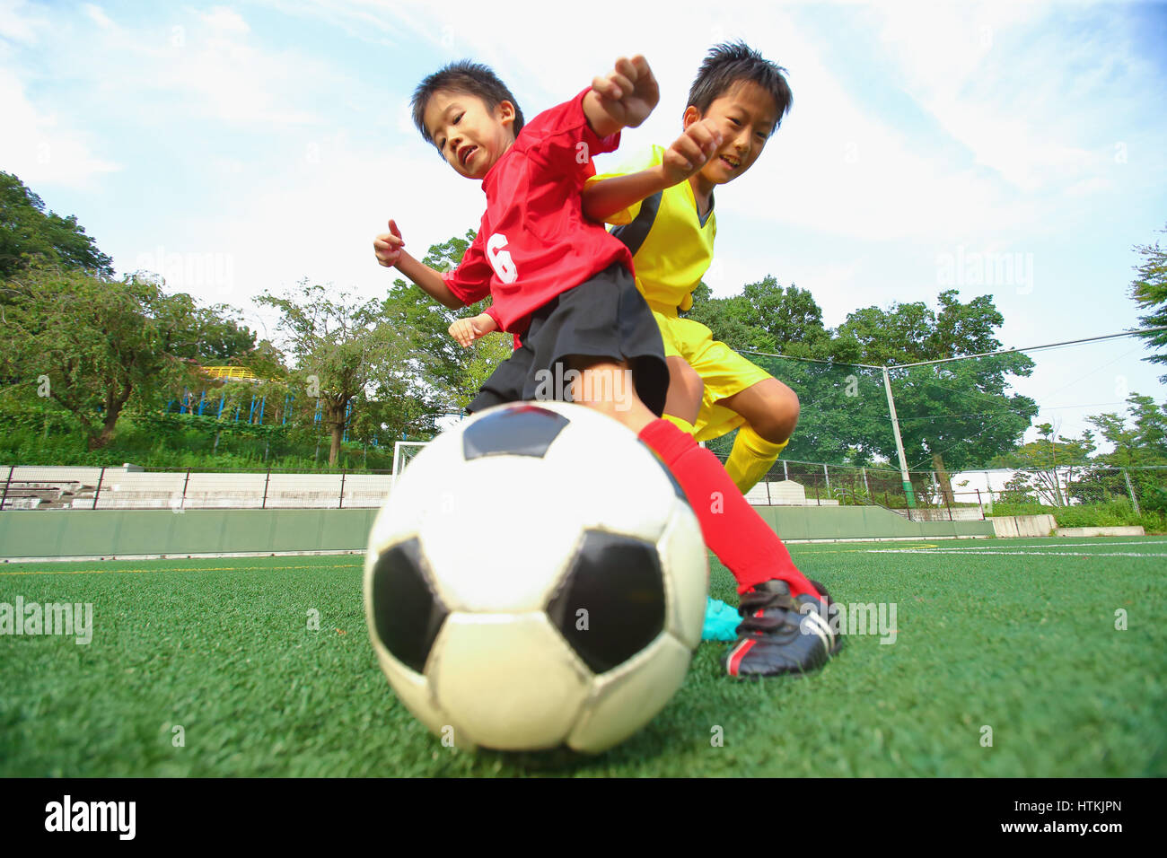 Japanese kids playing soccer Stock Photo Alamy