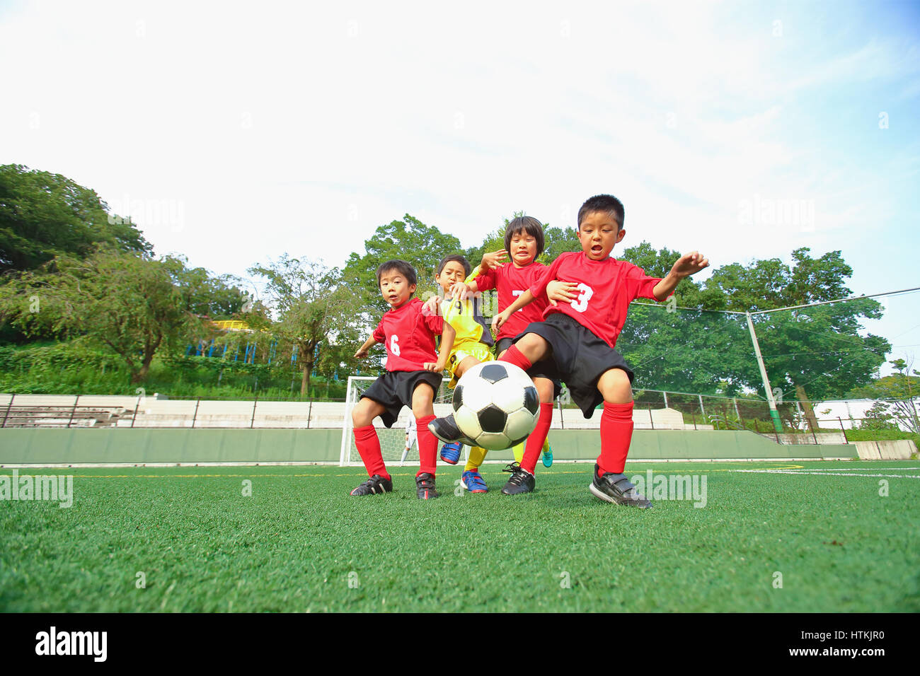 Japanese kids playing soccer Stock Photo Alamy