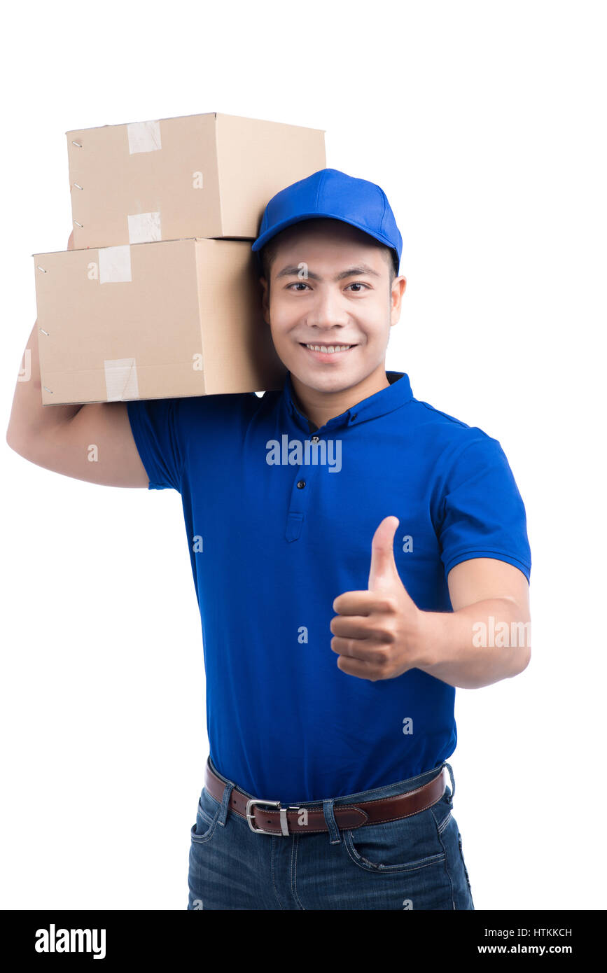 Delivery Person. Asian postman with parcel box thumps up. Stock Photo