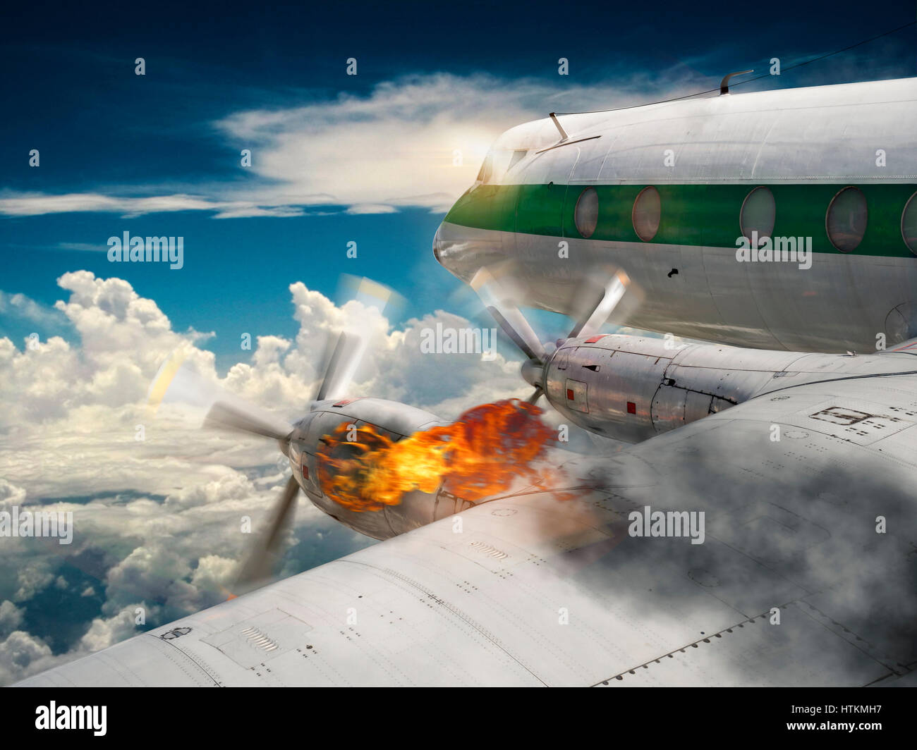 Airplane with burning engine Stock Photo