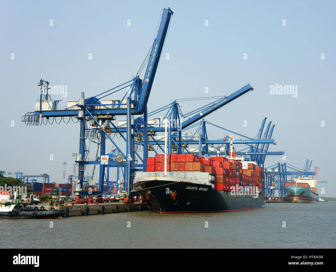 HO CHI MINH CITY, VIET NAM, Transportation for export, import at Cat Lai port, crane load container to boat, big industry service for trade, Vietnam Stock Photo