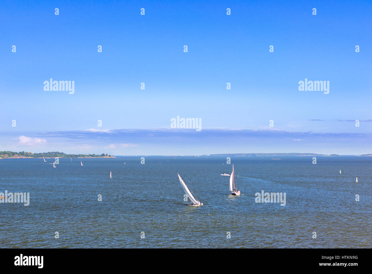Sailing regatta in Bay of West Harbour. Sailing ship yacht with white sails involved in water sports. Marine navigation in sunny summer day. Suomi, He Stock Photo