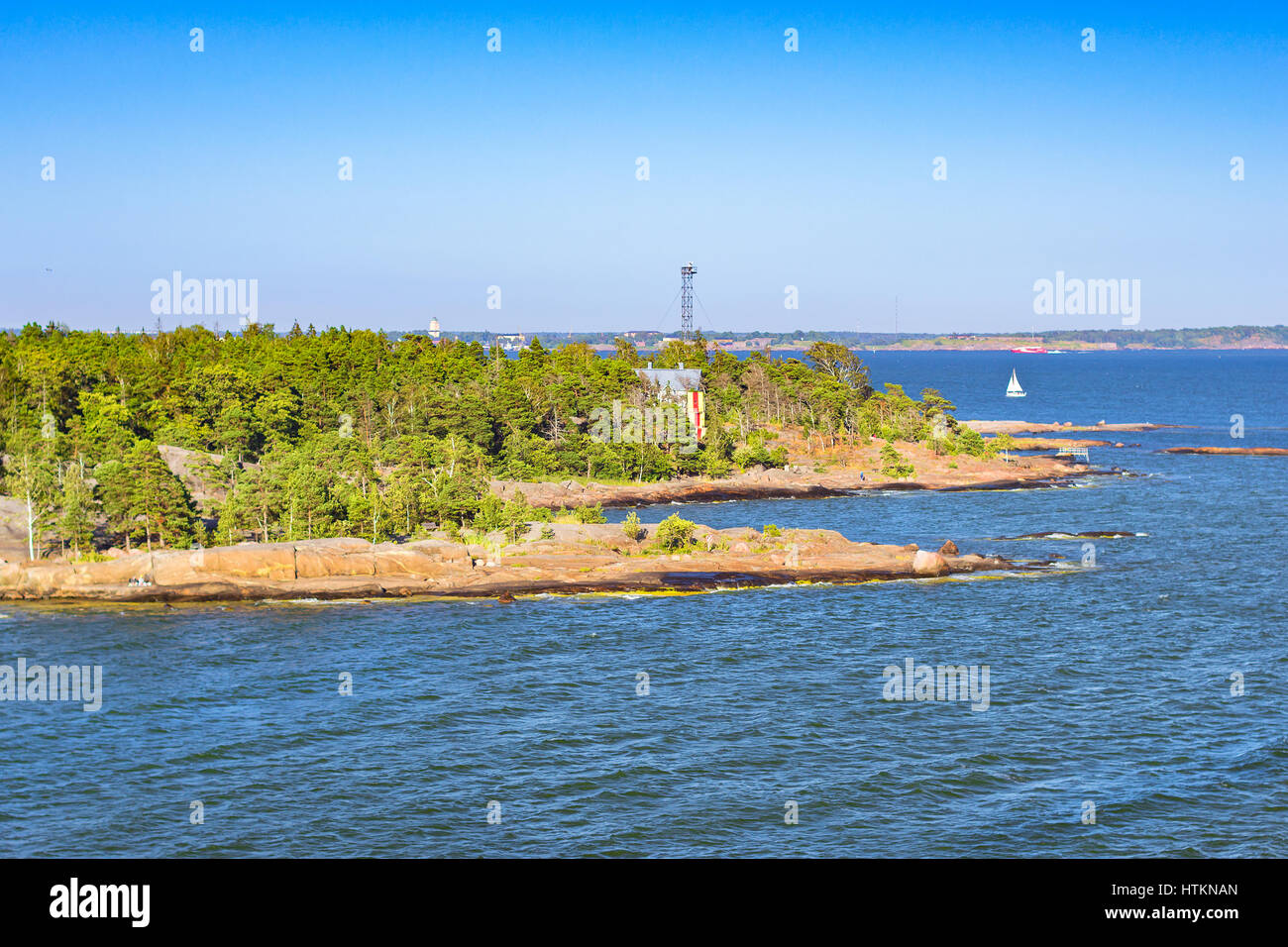 Stone beach with places for sunbathing, swimming and relaxing on a rocky island in Pihlajasaari Recreational Park. Scandinavian islands architecture i Stock Photo