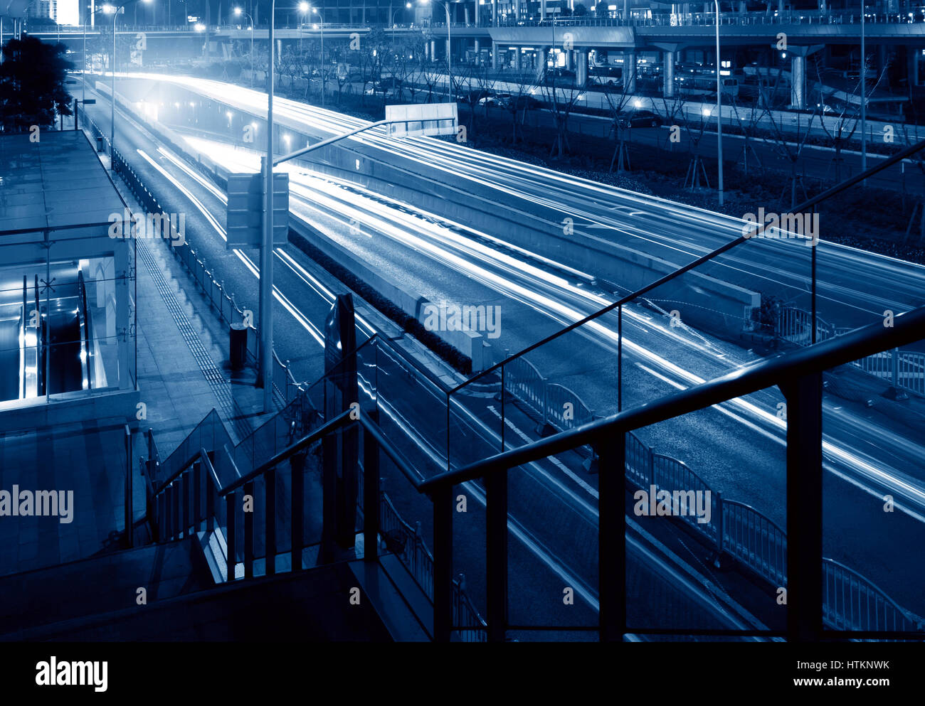 Highway light trails, modern city at night Stock Photo - Alamy